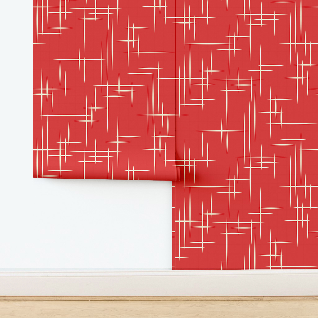 The artwork consists of a red square background with a repeating pattern of starburst shapes created by intersecting elongated lines. These lines are light-colored, contrasting sharply against the red background. The lines form multiple four-pointed stars with varying lengths and thicknesses, radiating outward in a geometric arrangement. The composition presents a clean, mid-century modern aesthetic, emphasizing simplicity and bold contrasts.